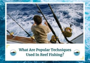 A person standing on the deck of a boat, facing the ocean, with several fishing rods set up along the railing. The water is choppy, and the boat appears to be moving. The person is wearing a light-colored shirt. The image is framed by a design resembling water waves. Below the photo is a caption: 'What Are Popular Techniques Used In Reef Fishing?' with two small circular icons depicting a boat on water, which is the logo of Fish Daily Charters.