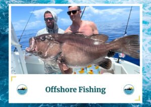 Two men holding a large fish on a boat. The man on the left is wearing sunglasses and a hoodie, while the man on the right is shirtless with sunglasses and wearing shorts with rubber duck patterns. The background features calm blue ocean water and a clear sky with some clouds. The image is framed by a design resembling water waves. Below the photo is a caption: 'Offshore Fishing' with two small circular icons depicting a boat on water, which is the logo of Fish Daily Charters.