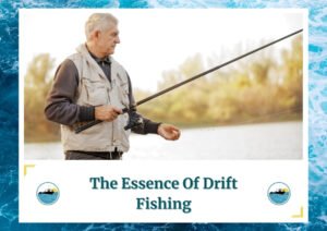 An elderly man stands near the water's edge, holding a fishing rod and focusing intently on the activity. He wears a beige vest over a dark sweater, appearing experienced and absorbed in drift fishing. The text at the bottom of the image reads The Essence Of Drift Fishing, with the Fish Daily Charters logo on either side.