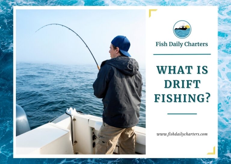 A man is standing on a boat, focused on his fishing rod as he reels in a catch. He is wearing a jacket and a baseball cap. The ocean is calm with a misty horizon. The text at the bottom reads What Is Drift Fishing? with the Fish Daily Charters logo on either side and the website URL www.fishdailycharters.com below.